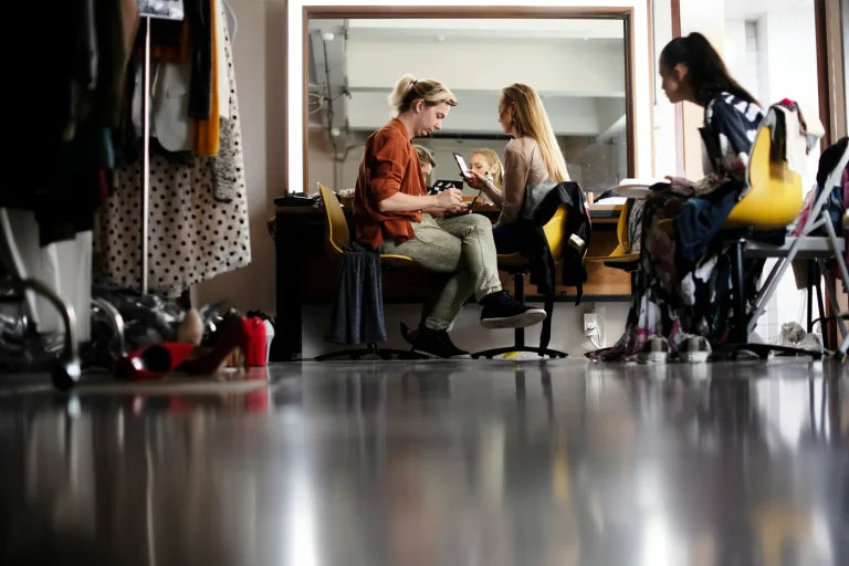 Group activity in a bright rehearsal/studio space.